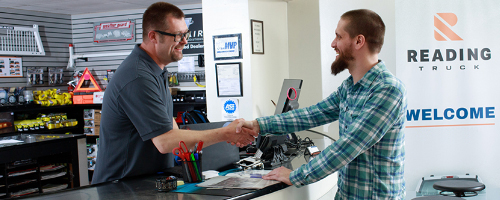 Two men shaking hands at Reading Truck location