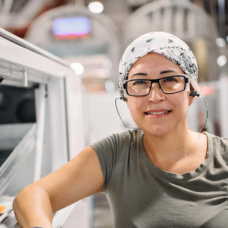 factory worker wearing earplugs